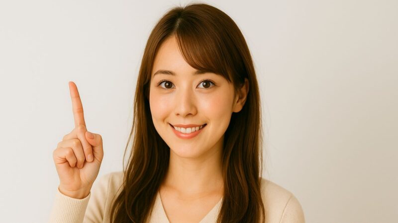 女性 人差し指 茶髪