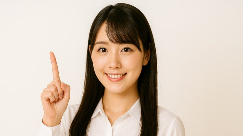 女性 人差し指 白いワイシャツ